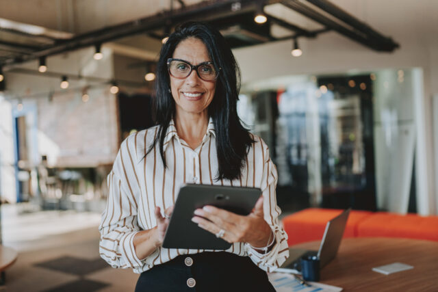 Small business owner evaluating FisherSMB's fiduciary support for retirement plans, highlighting the need for expert guidance and plan oversight in order to stay in compliance.