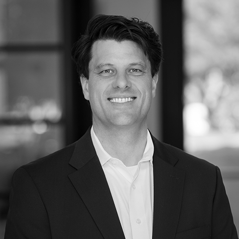 Black and white image of CEO Nathan Fisher
