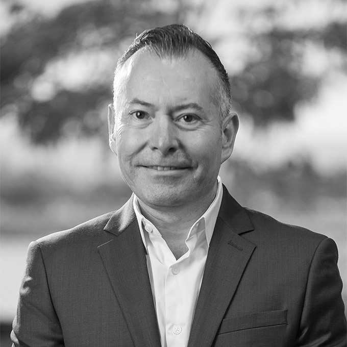 Black and white image of man in blazer. This is Eleazar Avalos' bio.