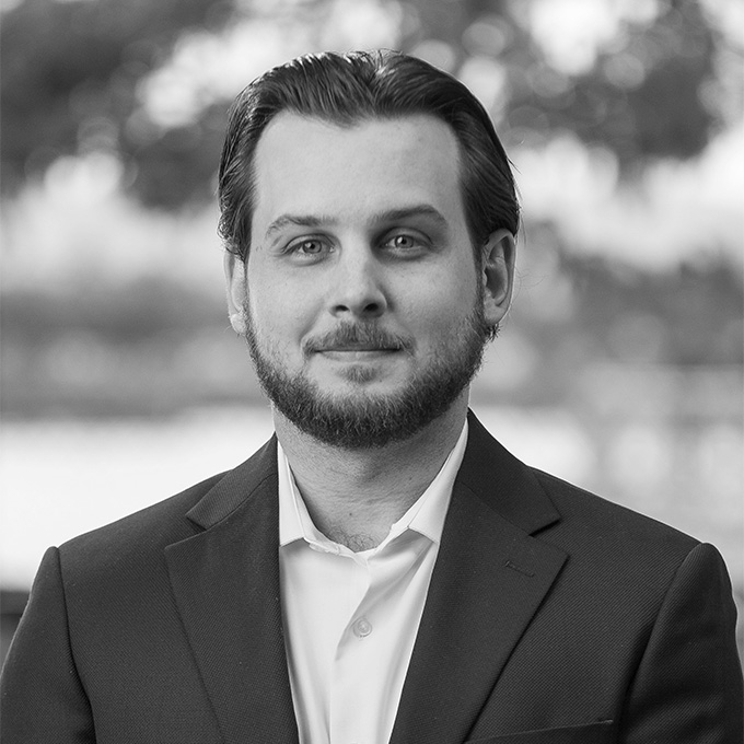 Black and white image of man in blazer. This is Matt O'Brien's bio.